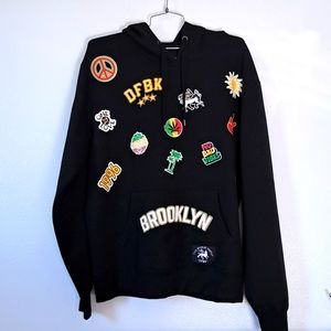 The Marley Family Hoodie applique black large.